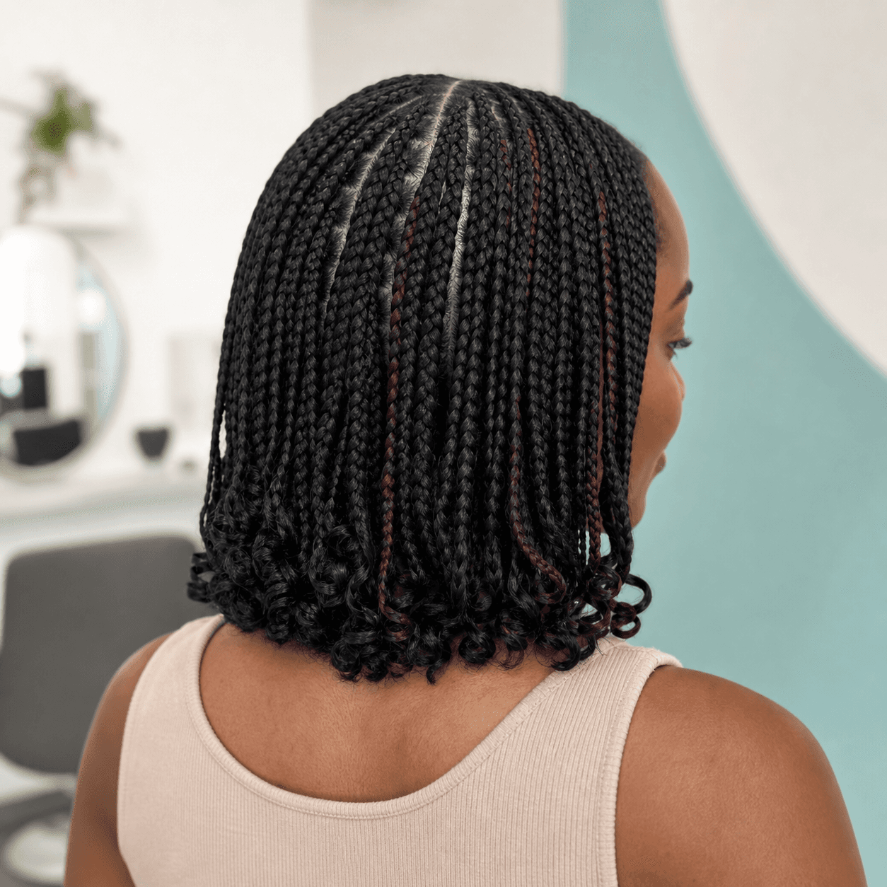 Precision braided bob with clean parting by Amara Okafor